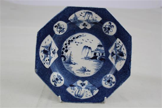 A Bow powder blue ground octagonal plate and a Worcester Three Flowers bowl, c.1765-80, 7.75in. & 8.25in.
